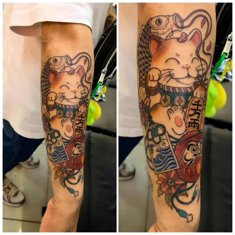 colored japanese-style maneki-neko lucky cat with daruma doll 