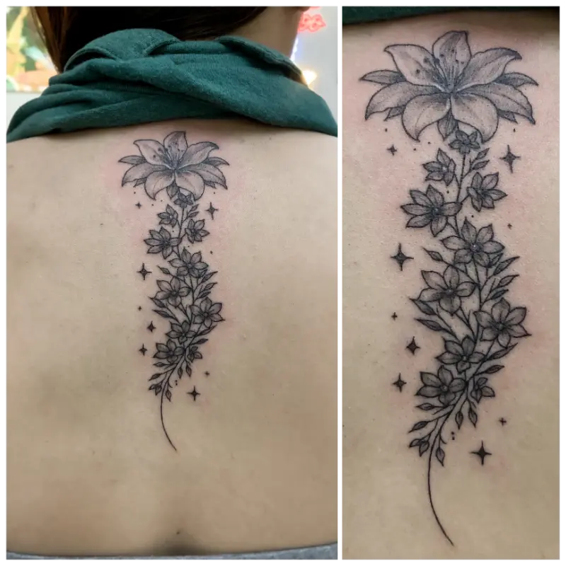 black and grey flower stem tattoo